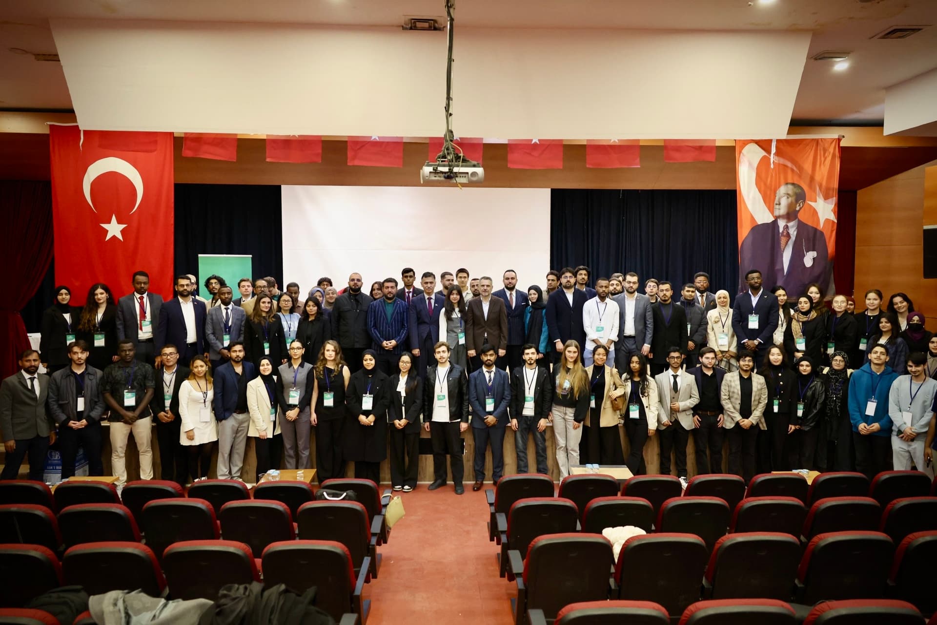 Delegates and speakers during an in-person forum
